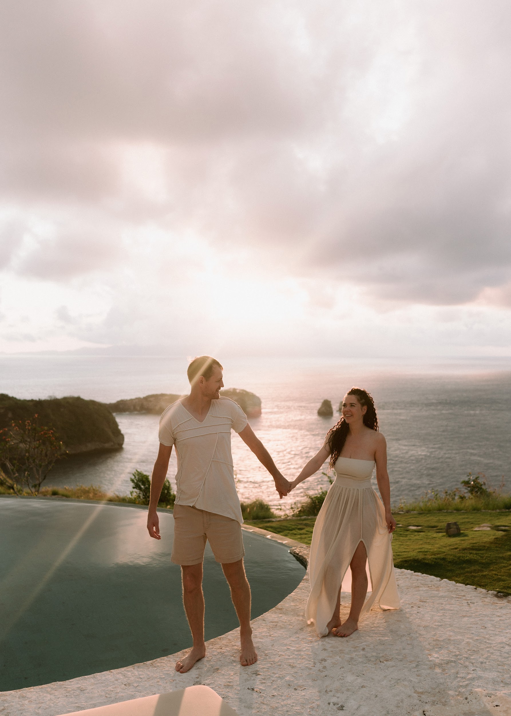 Laura and Davis in a warm embrace surrounded by nature